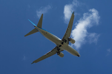 Fototapeta premium Bottom view of passenger airplane approaching Burgas airport