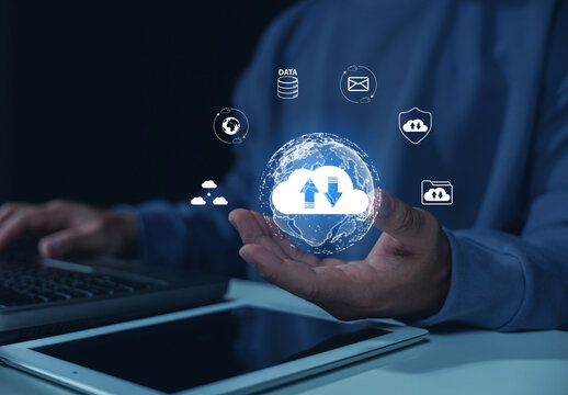 Business professional manages global cloud computing and digital data security through a connected network, illustrating upload, download, storage, backup, synchronization, and file sharing.