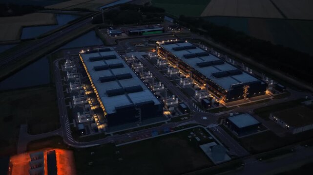Aerial view of a hyperscale data center at night