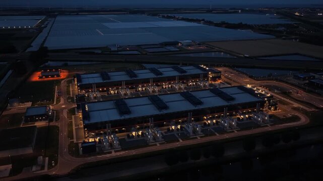 Hyperscale data center aerial view at night for ai and cloud computing
