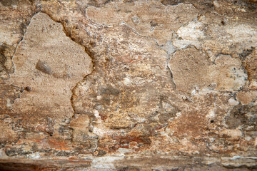 Old stucco wall showing weathered peeling paint texture © Валентина Хруслова