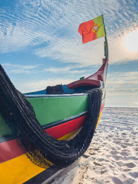 Traditional Portuguese fishing boat on sandy beach