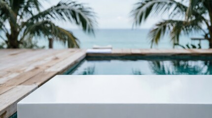Fototapeta premium White Table Top with Pool and Ocean View for Product Display