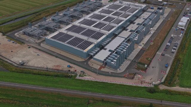Aerial view of modern hyperscale data center with solar panels