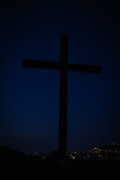 A prominent cross stands silhouetted against the twilight sky on Areopagus Hill in Athens, Greece, the traditional location of the Apostle Paul's famous sermon.