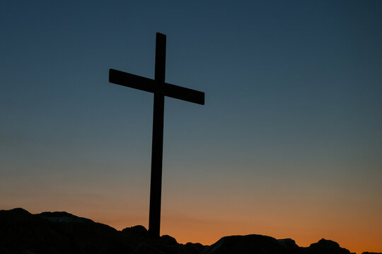 A cross stands silhouetted at sunset on Areopagus Hill in Athens, Greece, the traditional site associated with the Apostle Paul's famous sermon.