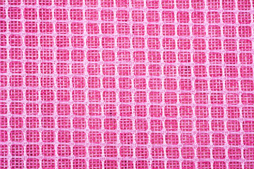 Pink fabric with woven grid pattern © reddish