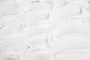 Textured white surface with rough brush strokes © reddish