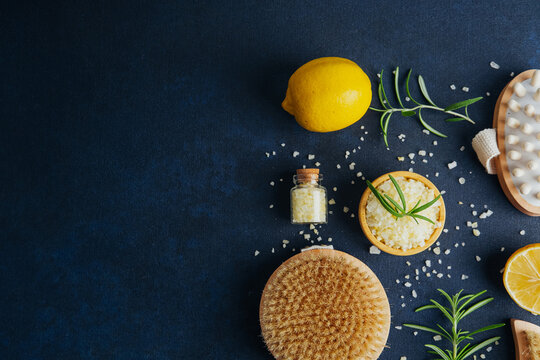 Lemon sea salt spa flat lay with bath brush and herbs