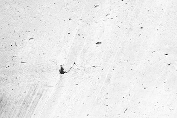 Concrete surface texture with small holes and cracks © reddish