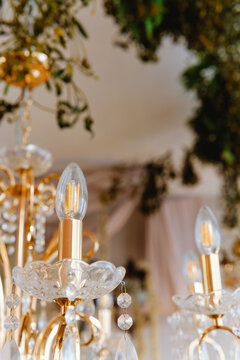 Elegant chandelier adorned with crystals and warm lighting in a stylish interior
