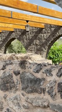 Exterior view and stone arches of the historic Bani Anif Mosque in Medina.