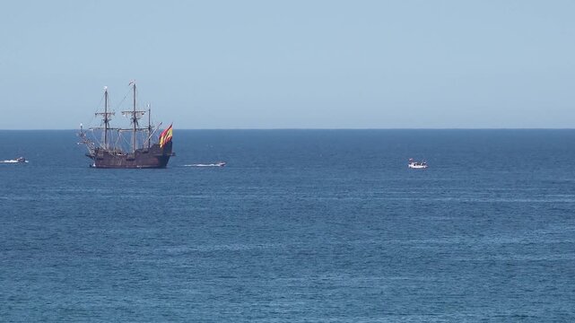 Historic Galleon with Spanish flag sailing close to the coast of Ireland in County Donegal