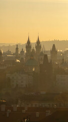Fototapeta premium Experience the breathtaking view of Prague's skyline as the sun sets, illuminating the historic spires and buildings.