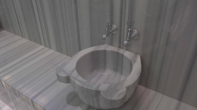 raditional Turkish bath interior with marble heated stone massage area and steam in luxury spa resort