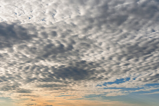 Amazing sky with lots of small clouds at sunset. Stunning scenery