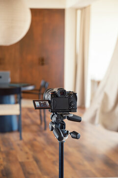 Photo camera on tripod while working