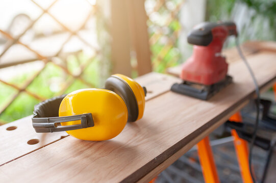 Safety earmuff protection carpentry timber workshop sander equipment hardware construction renovation craftsmanship maintenance production precision mechanic project compliance