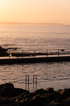 Sunrise at coastal bathing pools