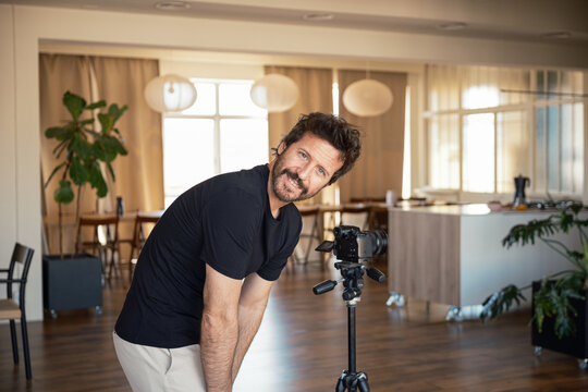 Cameraman preparing equipment For recording indoors