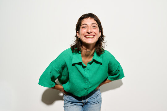 Direct flash Portrait of Smiling woman looking at camera