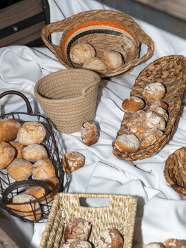 Fresh Bread Rolls Arranged in Decorative Serving Baskets