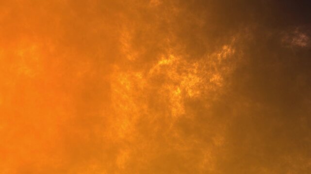 A short, looping animation of a stunning sky filled with golden, shimmering cloud layers.