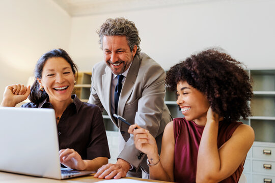 Professionals collaborating during office teamwork