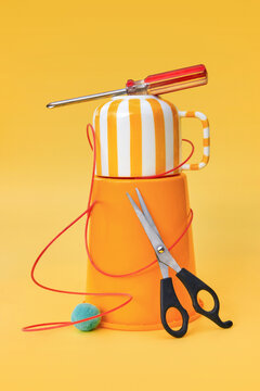 Everyday Tools and Objects on Yellow Background With Copy Space