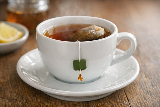 A tea bag steeps in a cup, perfect for a quiet moment