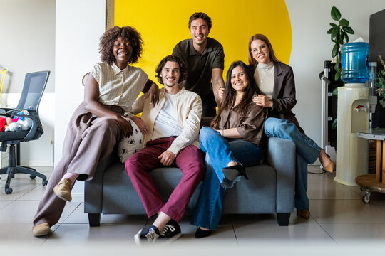 Happy diverse business team collaborating in office