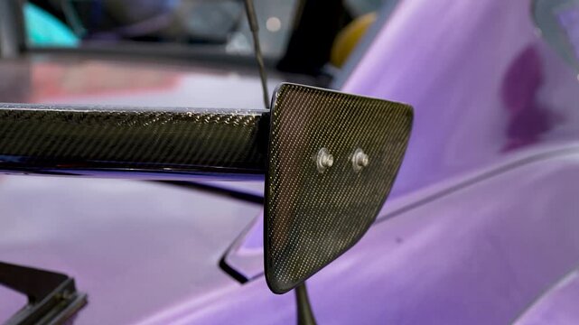 Large Carbon Fiber Rear Spoiler on Performance Sport Car, Aerodynamic Tuning Close-Up
