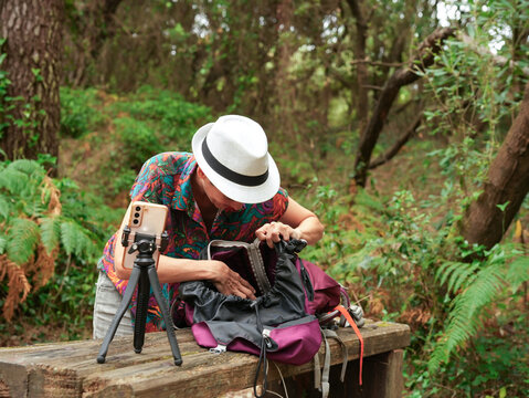Woman Searching In Backpack