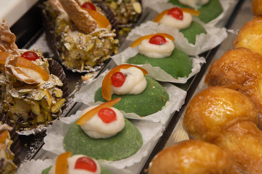 Cassatine siciliana. Assortment of traditional Sicilian pastries with marzipan and candied fruit.