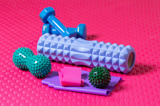 Home Fitness Equipment with Foam Roller, Dumbbells and Resistance Bands on Exercise Mat