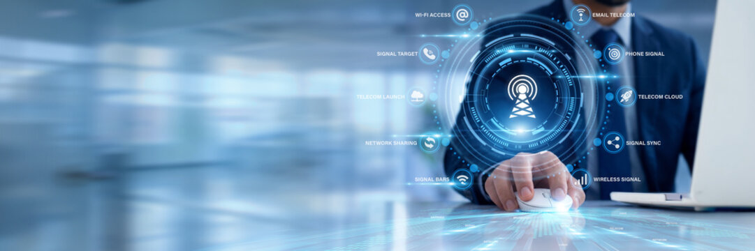Businessman using a laptop for telecommunications data analysis, monitoring cellular network traffic bandwidth, tracking wireless signal coverage statistics, optimizing digital fiber infrastructure.
