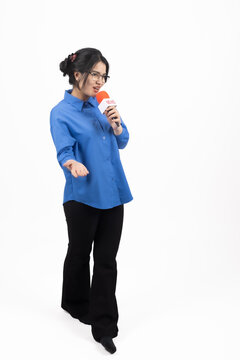 Thoughtful office worker standing with hand near her chin right at this exact mo