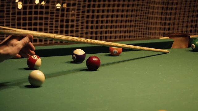 A game of pool. A successful shot - striking the red ball with the cue ball into the intended pocket