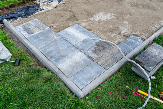 Paving slabs installation process for new patio or garden path