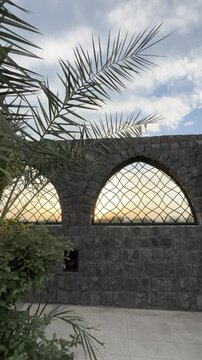 Stone arches and courtyard of the historic Masjid Bani Anif in Medina.