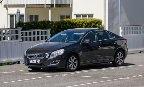 Gothenburg, Sweden - May 28 2026: 2012 Volvo S60 sedan parked in bright residential parking lot.