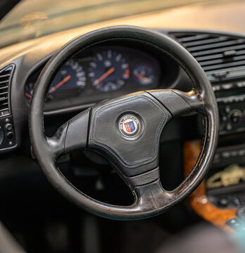 Gothenburg, Sweden - May 30 2026: Alpina steering wheel and dashboard detail inside classic convertible.