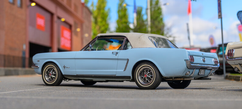 Gothenburg, Sweden - May 30 2026: Classic white Ford Mustang convertible viewed from low side angle.