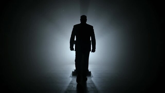 Silhouette of politician walking to podium for speech