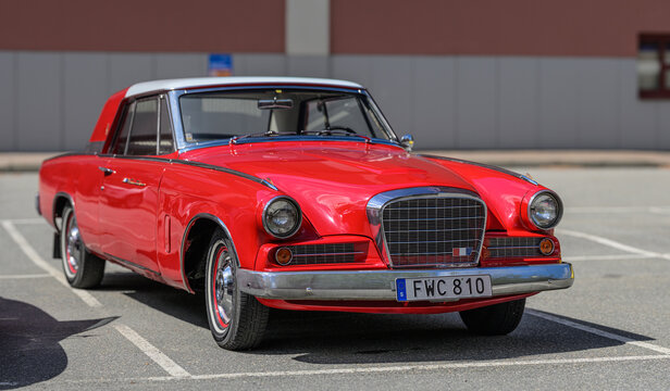 Gothenburg, Sweden - May 30 2026: Red Studebaker Gran Turismo Hawk coupe at classic car exhibition.