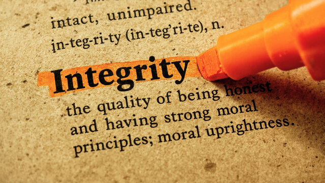 Integrity definition highlighted in dictionary. Moral principles and honesty concept.