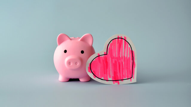 Pink Piggy Bank with Red Heart Symbolizing Saving Money for Love Family and Important Goals