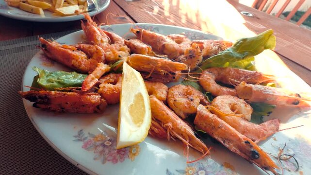 Fried King Prawns Served With Lemon Wedge. Seafood Dish Mediterranean