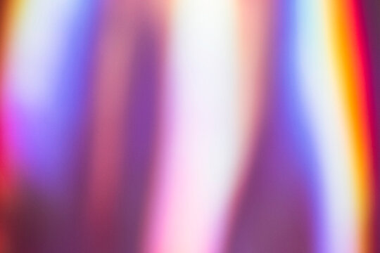 Abstract background with a smooth gradient of vibrant colors including purple, blue, and pink. The colors blend seamlessly, creating a soft and dynamic visual effect.