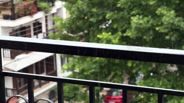 Raindrops Falling On Metal Balcony Railing. Summer Rain